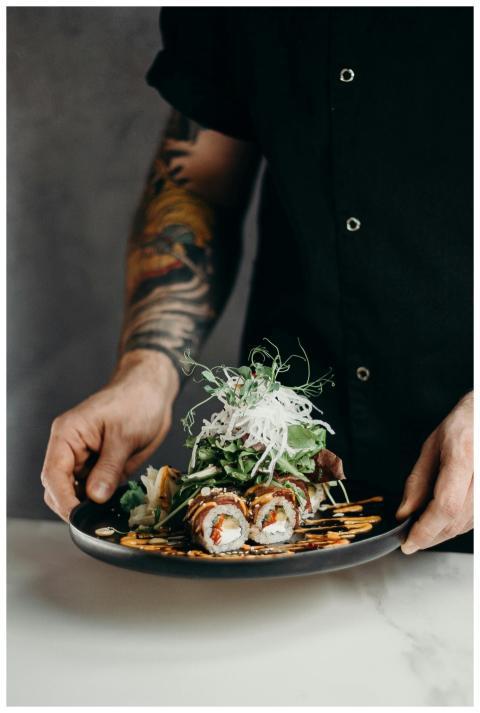 A gourmet sushi dish artistically presented with f