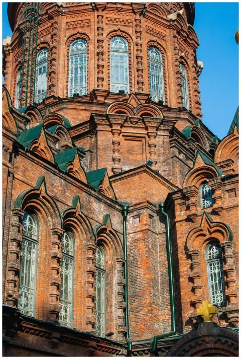 Close-up of a historic red brick chapel showcasing