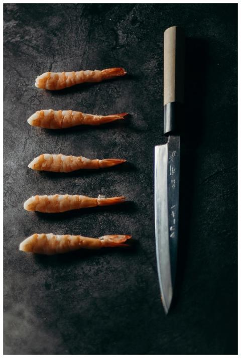 Top view of raw shrimp elegantly arranged with a s