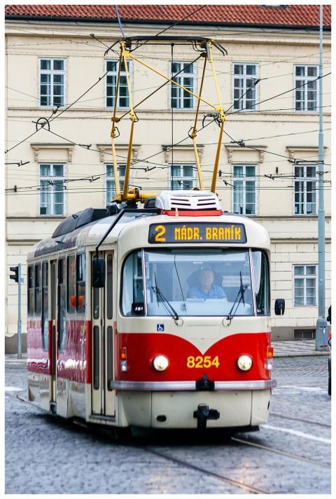 Iconic Prague tram no. 2 on cobbled streets in fro
