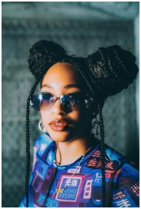 Fashionable woman in afro braids and sunglasses, s