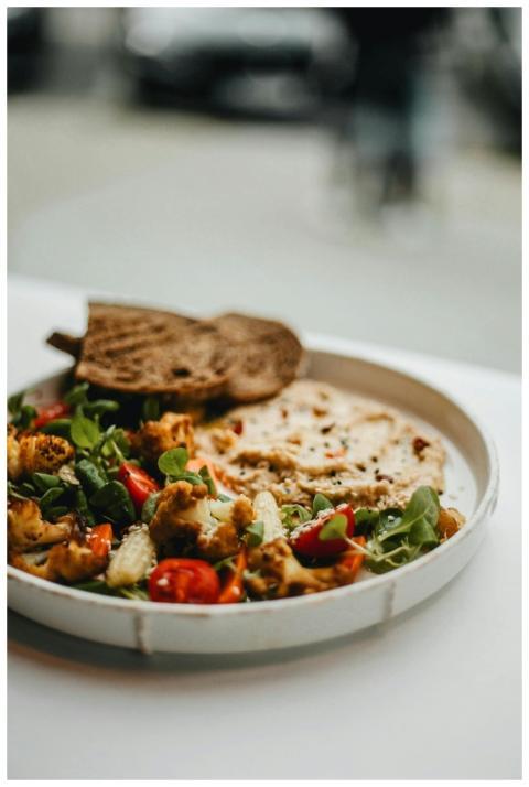 A vibrant vegan salad with roasted vegetables and