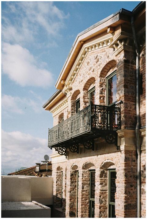 Elegant stone architecture with an ornate balcony