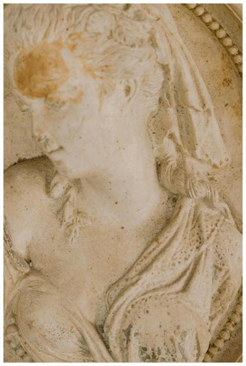 Detailed close-up of an ancient marble bas-relief