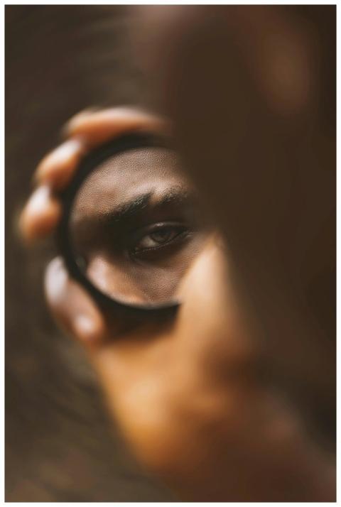 Captivating close-up of a person's eye reflected i