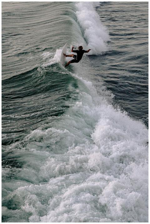 Captivating image of a surfer riding a powerful wa