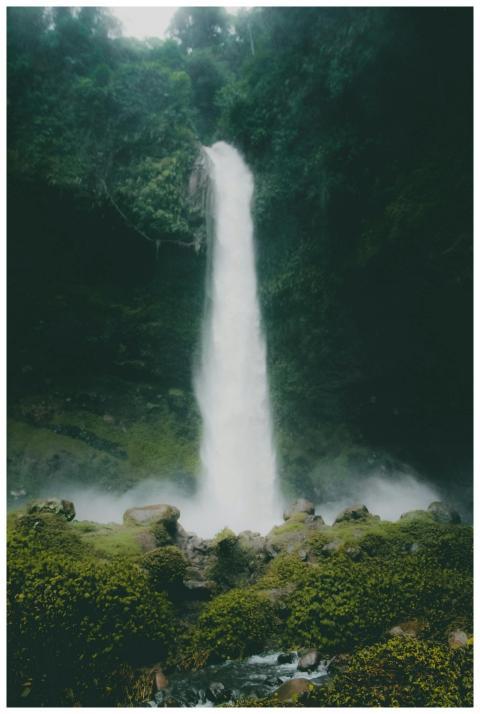 A stunning waterfall in lush rainforest in Kota Ta