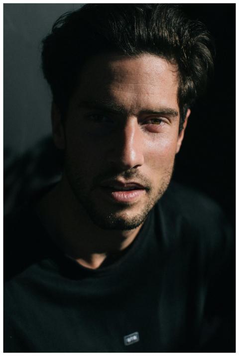 Serious masculine male with beard and modern hairc