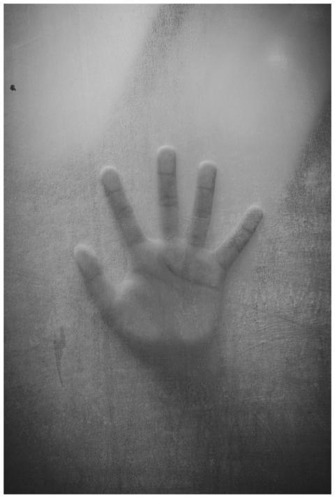 Abstract black and white image of a handprint agai