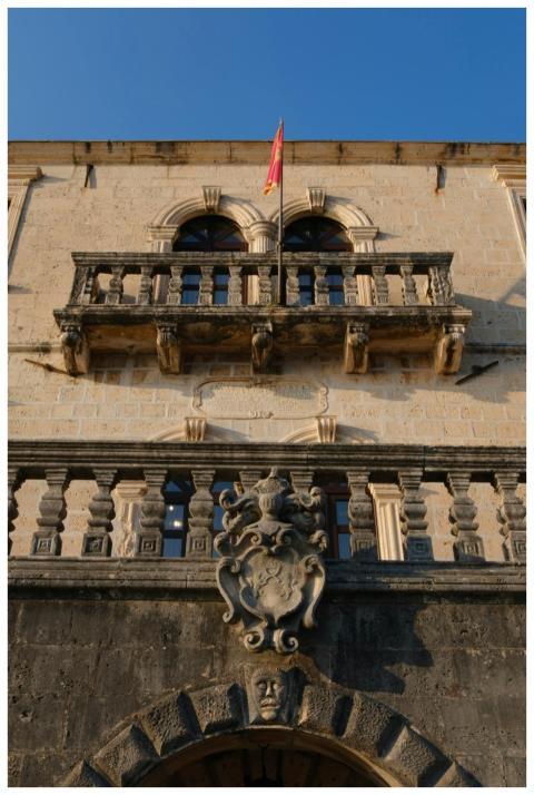 Close-up of a historic stone facade featuring intr