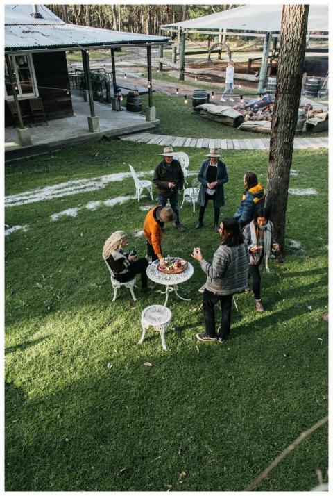 A group of friends enjoying a picnic in a rustic o