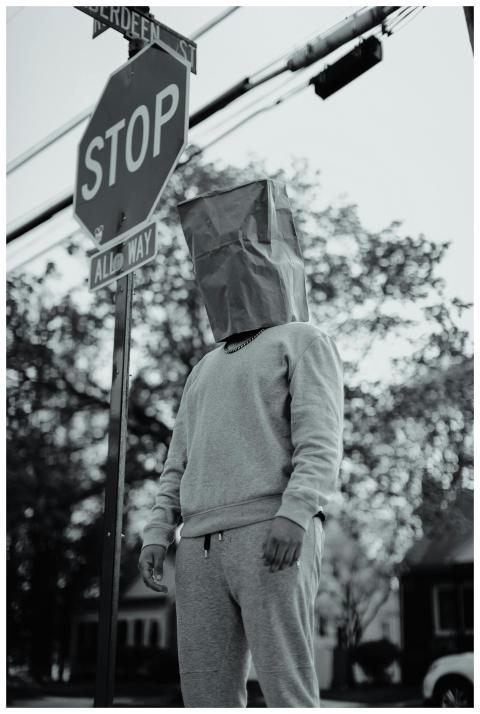 Artistic photo of an anonymous figure with a paper