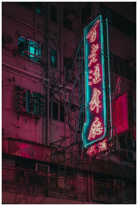 Neon signs illuminate the night in Kowloon, Hong K