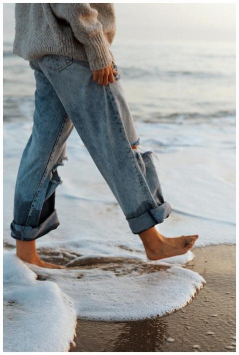 Side view of crop unrecognizable barefooted female