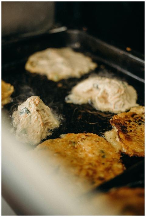 Delicious Korean pancakes sizzling on a grill at a