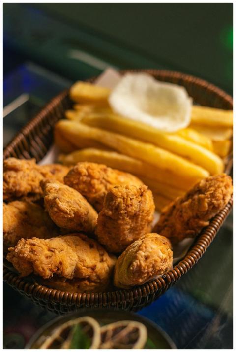 Delicious crispy fried chicken with fries served i