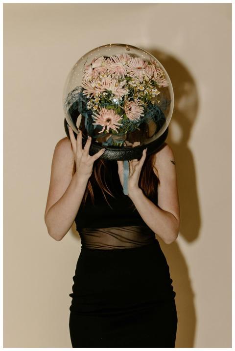 A creative portrait of a woman in a black dress we