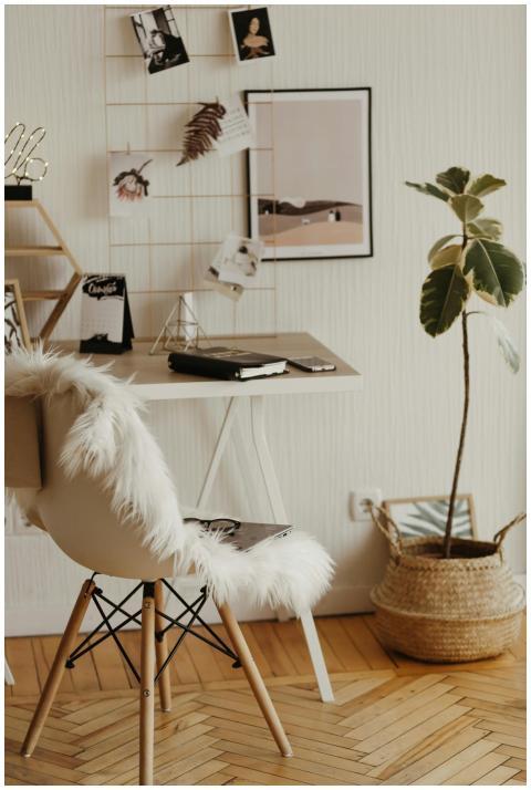 A stylish home office with a furry chair, sleek de