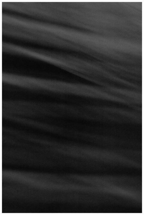 Dark abstract black wave texture with a smooth flo