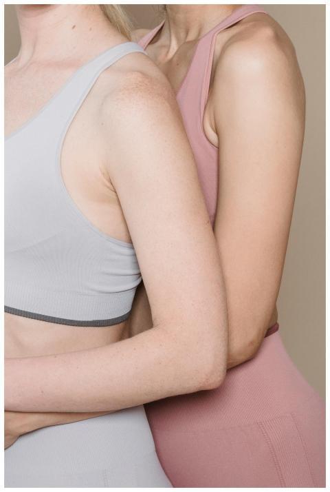 Studio shot of two women modeling modern activewea