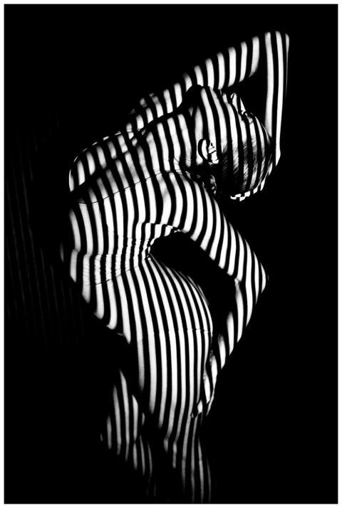 Black and white artistic photo of a woman with sha