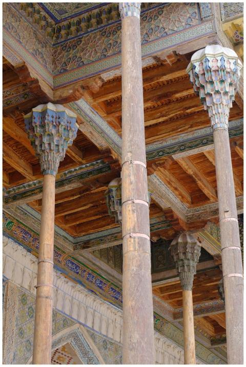 Close-up of intricate wooden columns in an ancient