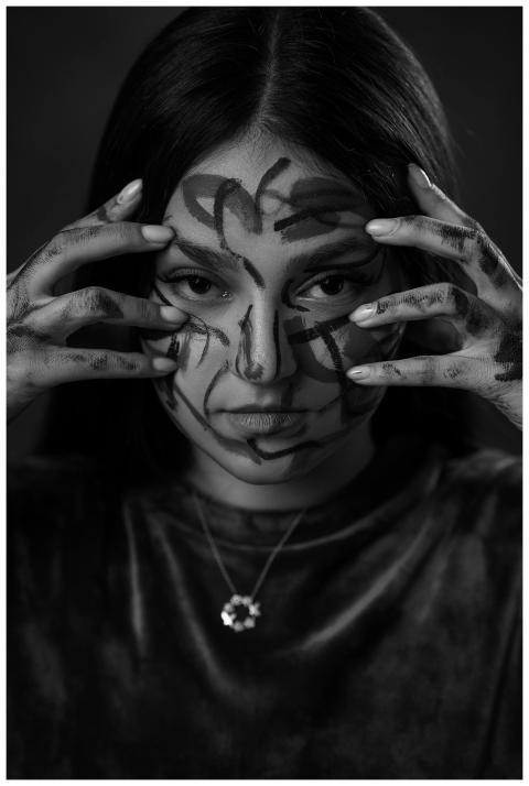 Black and white portrait of a woman with abstract