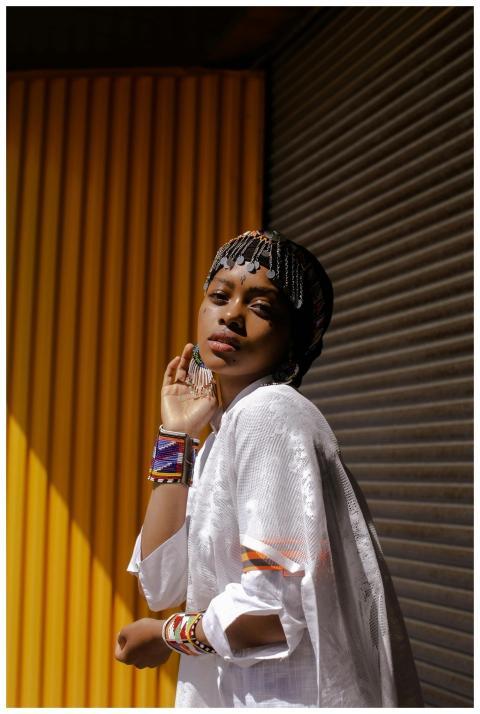 Elegant African woman poses fashionably in vibrant