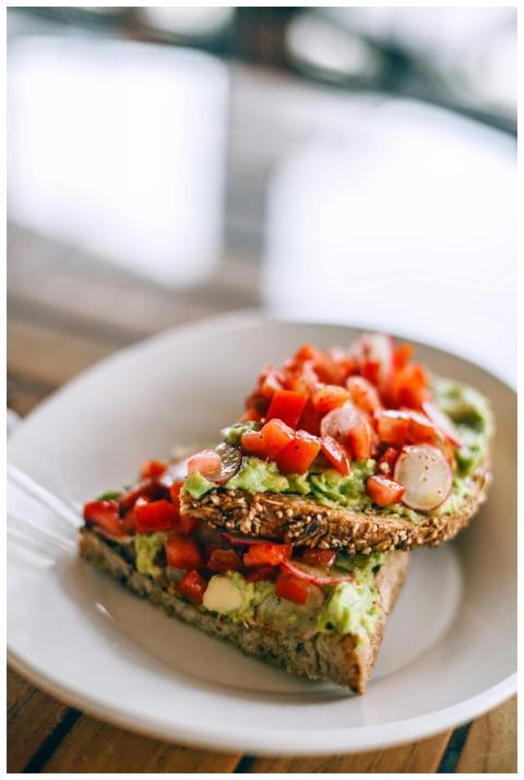 Delicious sandwiches with avocado and juicy tomato