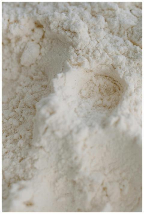 Detailed close-up of white flour with visible text