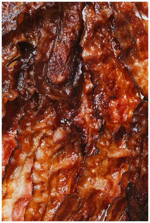 Close-up of crispy fried bacon strips, perfect for