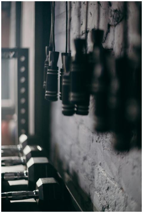 Close-up of gym equipment including dumbbells and