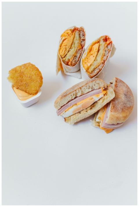 Tasty breakfast burrito and sandwich with hash bro