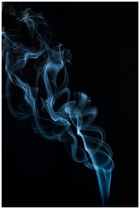 A captivating abstract image of blue smoke swirlin