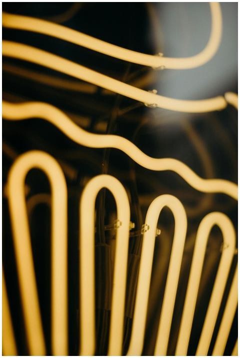 Artistic close-up of glowing neon lights with abst