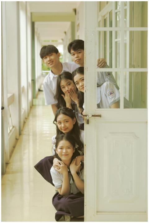 Group of students in uniforms having fun in a scho
