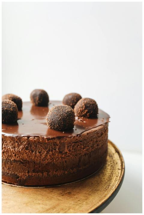 Indulge in a rich chocolate mousse cake topped wit
