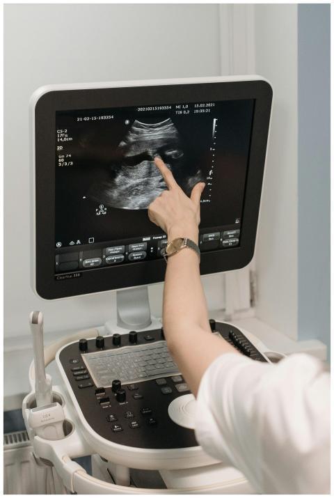 A medical professional analyzing an ultrasound ima