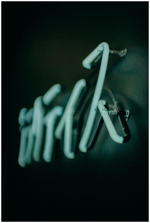 A creative close-up of a glowing blue neon sign, c