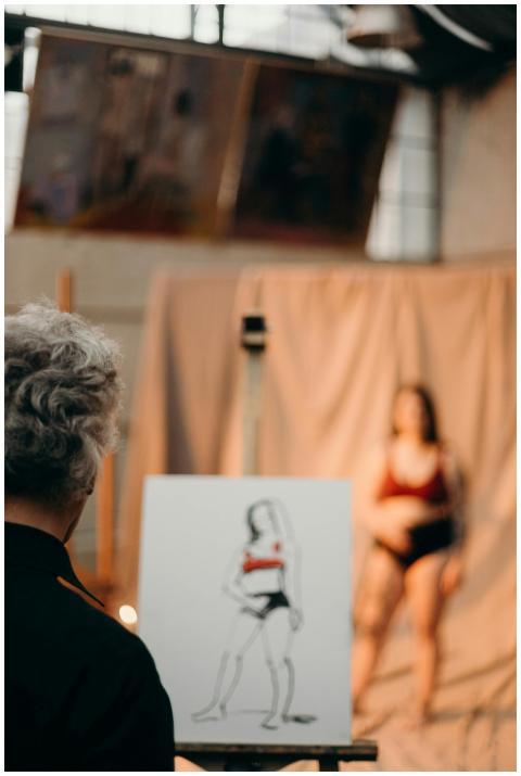 A life drawing session in an artist's studio featu