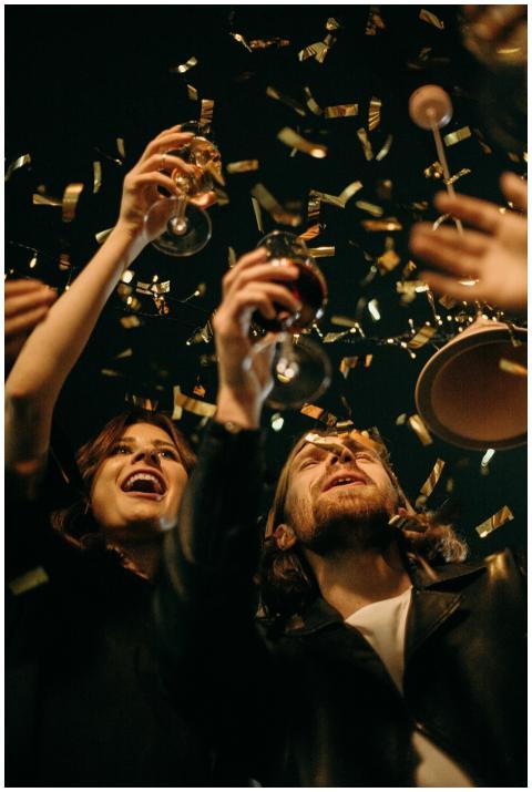 Group of friends enjoying New Year's Eve party wit