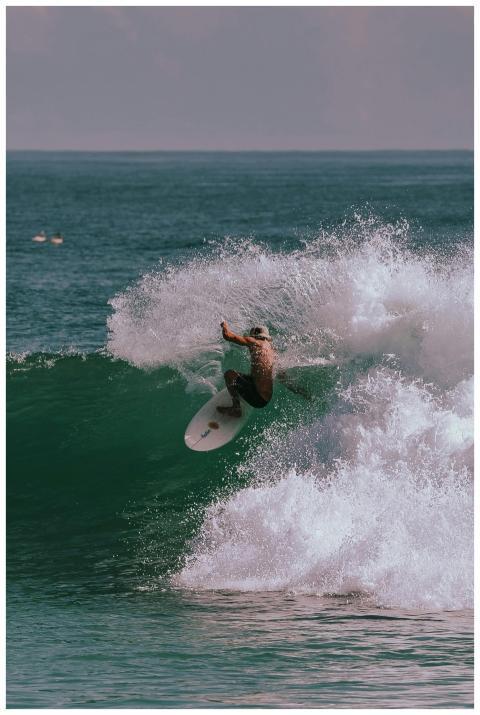 Dynamic photo of a surfer skillfully navigating a