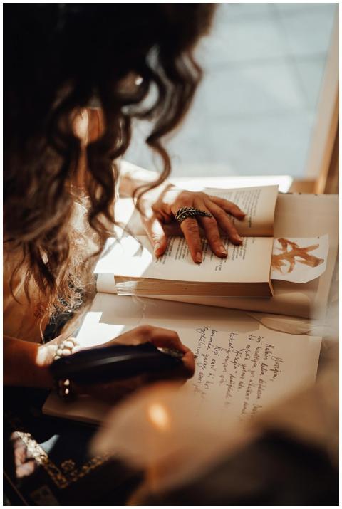 Crop anonymous female with dark hair sitting near