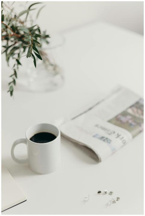 A minimalist workspace featuring a coffee mug and