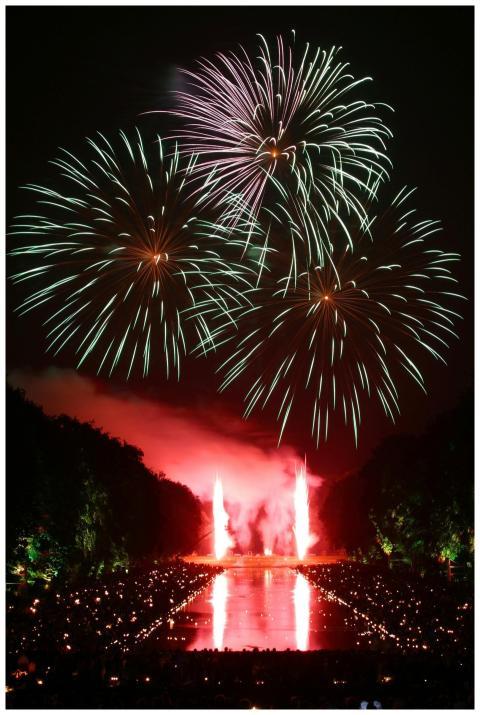 Dazzling fireworks illuminate the night sky with r