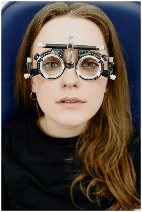Close-up of a woman with optometry trial frame at