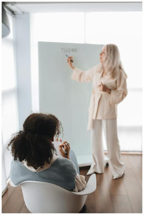Two women engage in an interactive learning sessio