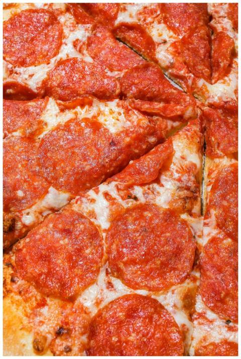 Close-up view of mouth-watering pepperoni pizza sl