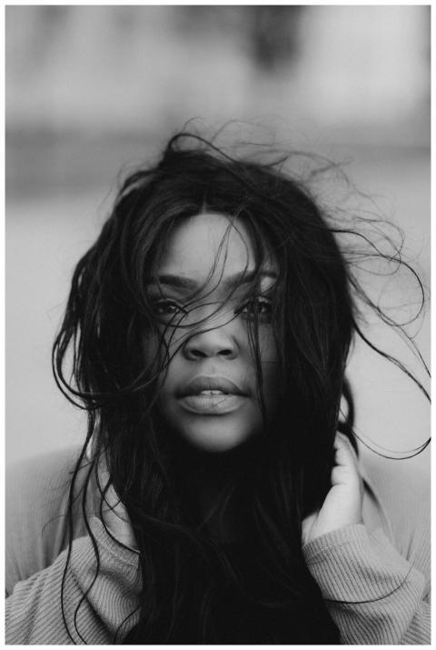 Black and white portrait of a woman with flowing h