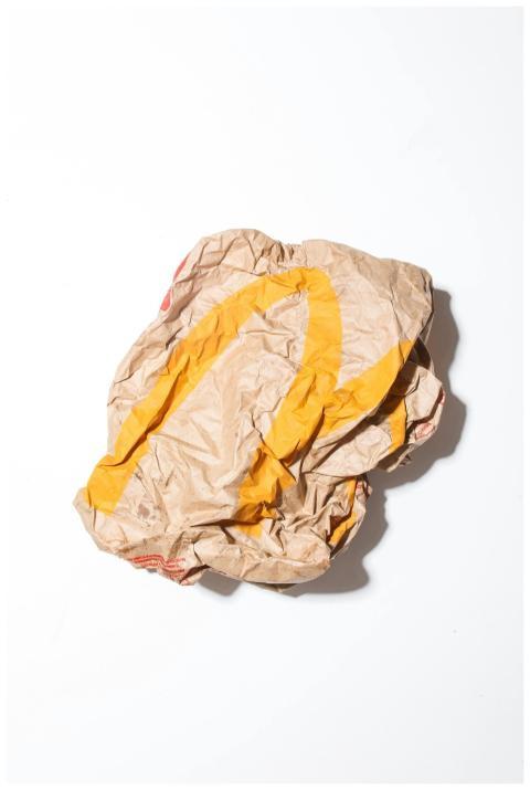 Top view of crumpled empty craft paper bag of fast